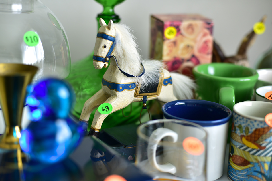 Close up image of a table of garage sale items