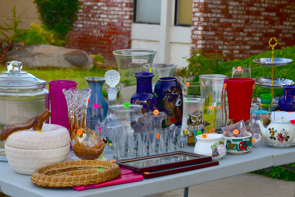 Table of housewares at a garage/yard sale