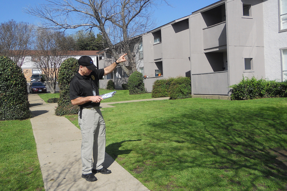 Image of an Arlington Code Compliance officer doing an inspection of a multi-family property.